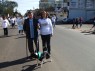 Sr. Danuncio e voluntria Rita com o cachorro "Lula".